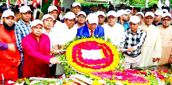 Mohammad Mosaddek-ul-Alam, Managing Director of Ansar-VDP Development Bank Limited, placing floral wreaths to pay homage at the portrait of Bangabandhu Sheikh Mujibur Rahman at Dhanmondi-32 on the occasion of his birth centenary on Tuesday.