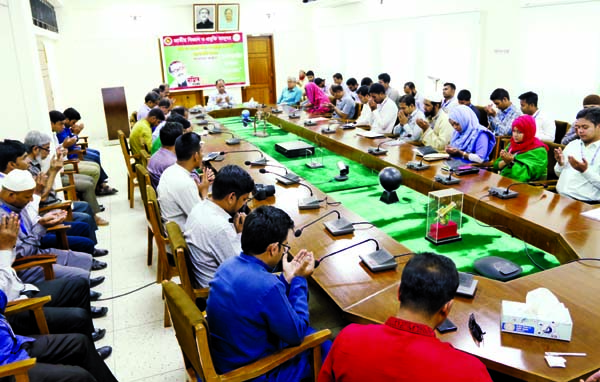 Director General of the National Science and Technology Museum Munir Chowdhury along with other officials and employees of the museum offering munajat marking the birth centenary of Bangabandhu at the office in the city on Tuesday.