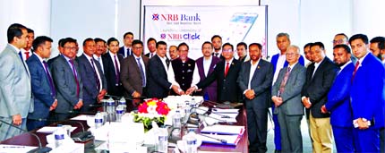 Mohammed Mahtabur Rahman, Chairman of NRB Bank Limited, launching the bank's Mobile Banking App "NRB Click" by cutting a cake at a simple ceremony held at Bank's Corporate Head Office Dhaka recently. Through this App the customers of NRB Bank can easi