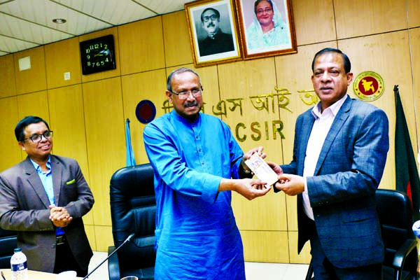 Science and Technology Minister Architect Yeafesh Osman donating Taka one lakh to the Chairman of Bangladesh Council of Scientific and Industrial Research Faruk Ahmed at its conference room in the city on Thursday to make hand sanitizer.