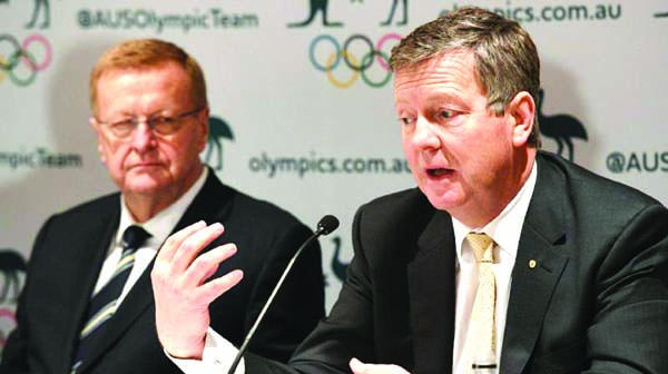 Australian Olympic Committee (AOC) chief executive officer Matt Carroll (right) speaks as AOC president John Coates looks on Thursday.