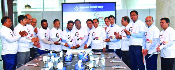 Md. Sanaullah Shahid, Chairman of Shahjalal Islami Bank Limited, inaugurating 'Mujib Year' celebration programme by cutting a cake at the bank's head office in the city recently. Managing Director M Shahidul Islam, Vice-Chairman Md Abdul Barek, Directo