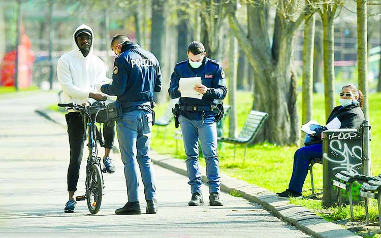 Police check in a public park in the Martesana district as the spread of coronavirus disease (COVID-19) continues in Italy on Saturday.