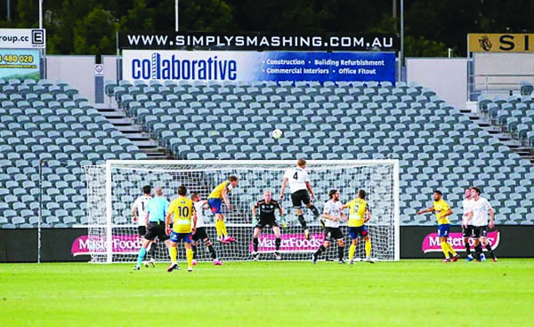 Goal-mouth action showing empty stadium due to the fan lockout from coronavirus during the A-league match between the Central Coast Mariners and Melbourne City on Saturday.