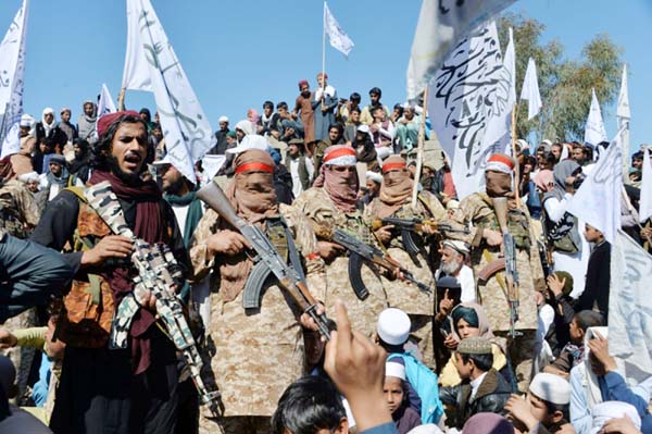 Afghan Taliban militants and villagers attend a gathering as they celebrate the peace deal and their victory in the Afghan conflict on US in Afghanistan, in Alinagar district of Laghman Province.