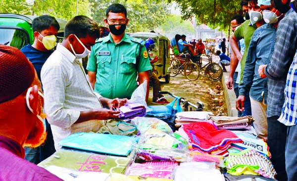 Police nabbed one for his involvement in selling used hand gloves in front of Dhaka Medical College Hospital on Monday.