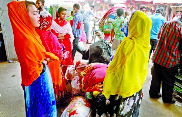 Home-bound launch passengers remain stranded for suspending launch plying. The snap was taken from Sadarghat Launch Terminal in the city on Tuesday.