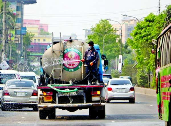 Dhaka North City Corporation authority spraying disinfectant in the city's different areas including Kakoli, Gulshan and Banani on Wednesday with a view to preventing coronavirus.