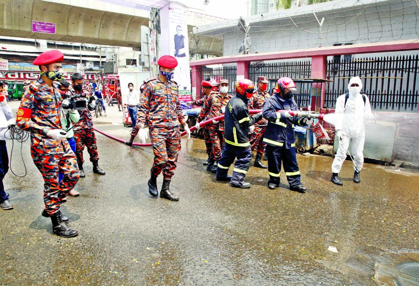 Fire Service and Civil Defense Department sprays medicinal disinfectants at Bangabazar in the city on Wednesday amid spread of coronavirus.