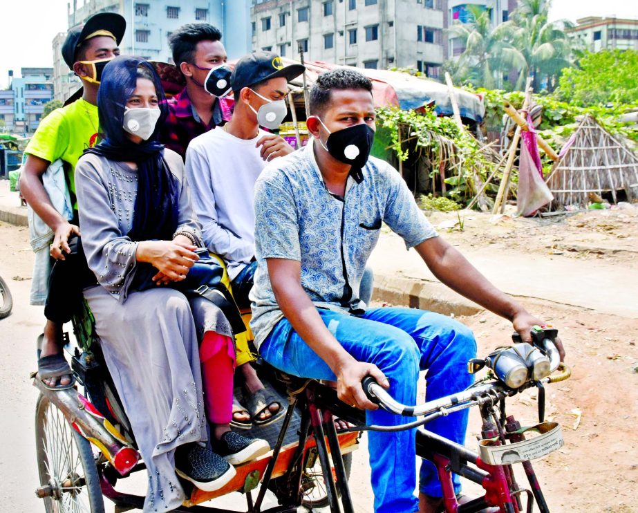 A rickshaw-puller carrying four passengers defying ban of the administration. The snap was taken from Dayaganj Railgate area in the city on Friday.