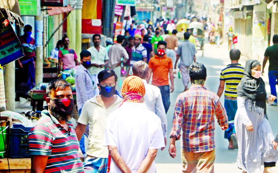 A section of people moving on the streets together defying ban of the administration to protect from coronavirus. The snap was taken from the city's Kamrangirchar on Friday.