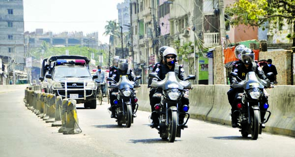 Different law enforcing agencies including RAB patrolling on the city streets to beef up security measures. The snap was taken from Chankharpool area on Saturday.