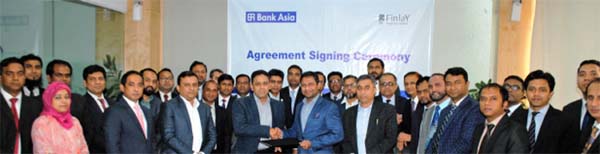 Mohd. Ziaul H Molla, Deputy Managing Director of Bank Asia Ltd and Mufakkharul Islam Khasru, Managing Director of Finlay Properties Limited, exchanging documents after signing an agreement at the bank's Chattogram Zonal Office recently. Under the deal, t