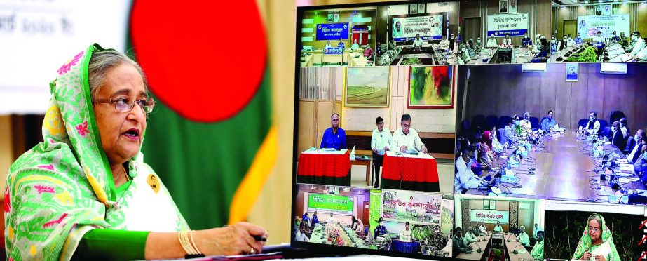 Prime Minister Sheikh Hasina speaking with field level officials through video conferencing from Ganobhaban on Tuesday with a view to coordinating ongoing activities to prevent coronavirus.