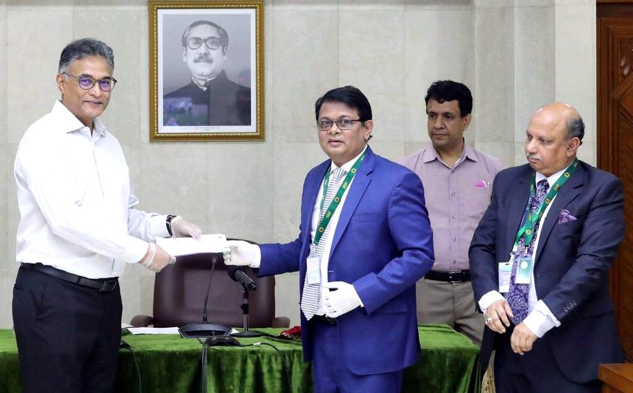 M. Reazul Karim, Managing Director of Premier Bank Limited, handing over a cheque of Tk. 5 crore to the Prime Minister's relief fund to combat the spreading of Covid-19 to Ahmad Kaikaus, Principal Secretary of Prime Minister at PMO recently. Syed Nowsher
