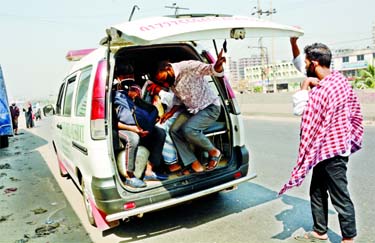 As public transport remains off, operators of emergency ambulance services carrying passengers from various points in Dhaka to make quick buck. This snap was taken from Sanir Akhra road on Wednesday.
