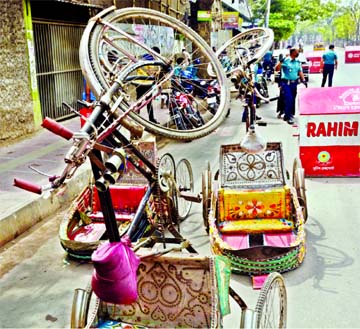 Law-enforcers overturned rickshaws as punishment as the rickshaw-pullers plying rickshaws defying ban. The snap was taken from the city's Manik Nagar Bishwa Road on Friday.