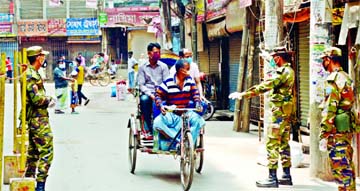 Army personnel deployed in different areas trying to raise awareness among the commoners to stay home with a view to protecting themselves from coronavirus. The snap was taken from Chwakbazar in th city on Friday.