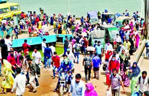 People, mostly garment workers, emerge from a ferry at Paturia in Manikganj on their way to Dhaka on Saturday amid the nationwide shutdown enforced to combat the spread of coronavirus.