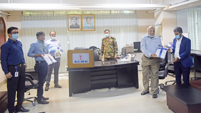 Md. Ferdous Khan, Director (Sales & Distribution) along with Sayed Hossain Patwary, General Manager (Procurement Division) of ACME Pharmaceutical Manufacturing Company, handing over the first consignment of PPE which includes protective gowns, face masks,