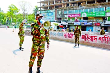 Army personnel engaged in raising awareness to the commoners through miking to stay at home due to coronavirus. The snap was taken from in front of the city's Babubazar flyover on Friday.