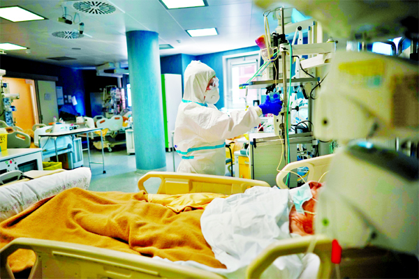 Medical staff tends to a patient in the ICU unit of San Filippo Neri Hospital's COVID-19 department in Rome.