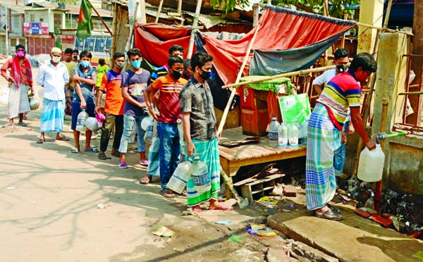 Due to acute shortage of drinking water the people of city's Kazla fetching water from a government facilities on Sunday.