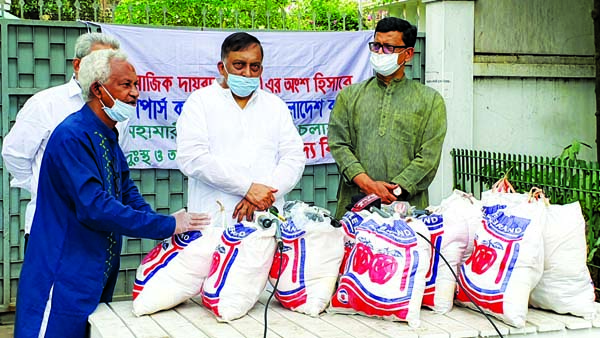 On behalf of Shippers Council of Bangladesh, State Minister of Shipping Khalid Mahmud Chowdhury handing over 2000 packets of food items to Home Minister Asaduzzaman Khan Kamal to distribute among the distressed people on Sunday.