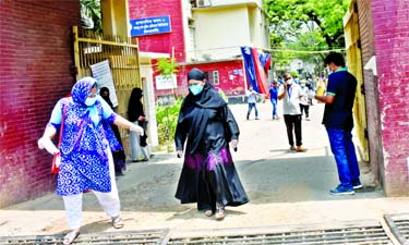 Patients are comming out from out of BSMMU after completion of medical treatment. This photo was taken on Thursday.