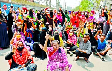 RMG workers stage protest at Kamlapur in Dhaka on Thursday demanding pay for the month of March.