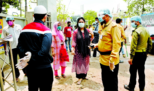 The commoners facing questions by the law-enforcers on different entry and exit points at Niketon area in the city's Gulshan on Saturday to raise awareness with a view to preventing coronavirus.