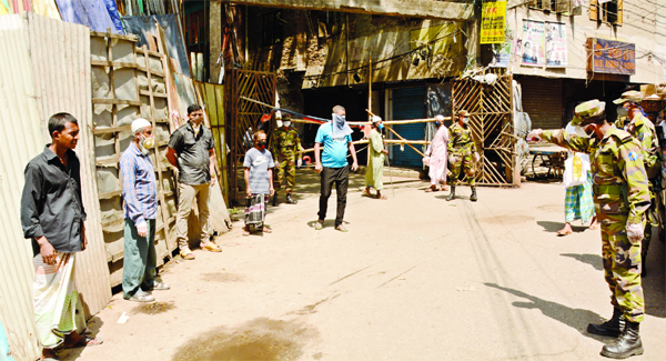 Some local people were punished by Armymen for defying lockdown over spread of novel Coronavirus in city's Bagdash Lane on Sunday.