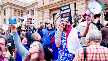 Protesters against the state's extended stay-at-home order to help slow the spread of coronavirus demonstrate at the Capitol building in Austin, Texas.
