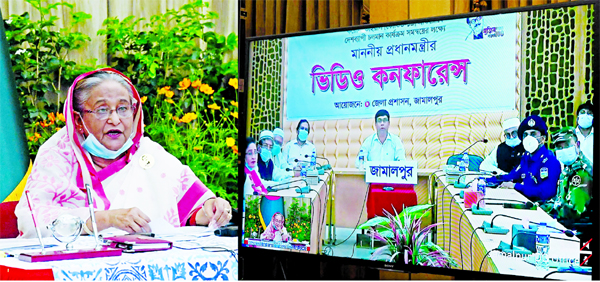 Prime Minister Sheikh Hasina exchanging views with the public representatives and officials of eight districts of Dhaka and Mymensingh divisions on the present coronavirus situation in the country through video conference from Ganabhaban in the city on Mo