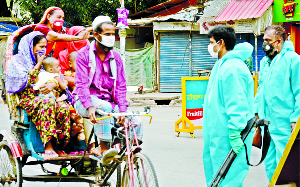 Police intercepted some rickshaw passengers who came out of their residence unnecessarily. The snap was taken from the city's Shahbagh on Tuesday.