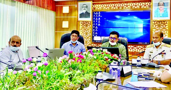 State Minister for Shipping Khalid Mahmud Chowdhury exchanging views with the authority concerned of Chattogram Port at its seminar room on Thursday about the steps of the port authority amidst coronavirus crisis.
