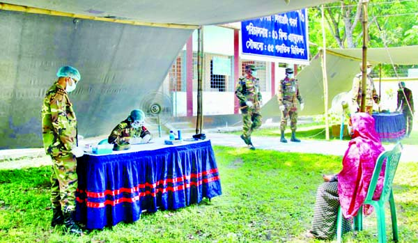Free Medical Camp of Bangladesh Army giving medical aid to the destitute at an area in Jashore on Thursday with a view to preventing coronavirus. ISPR photo