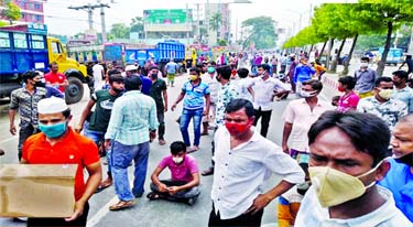Transport workers staged demonstration and blocked the Dhaka-Aricha Highway on Tuesday demanding withdrawal of ban on plying of public transport following countrywide lockdown to prevent spread of coronavirus.