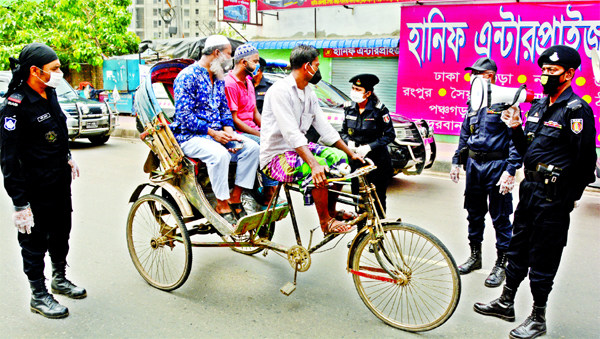 Members of RAB-4 asking commuters who came out of their residences amidst coronavirus. The snap was taken from the city's Kalyanpur area on Wednesday.