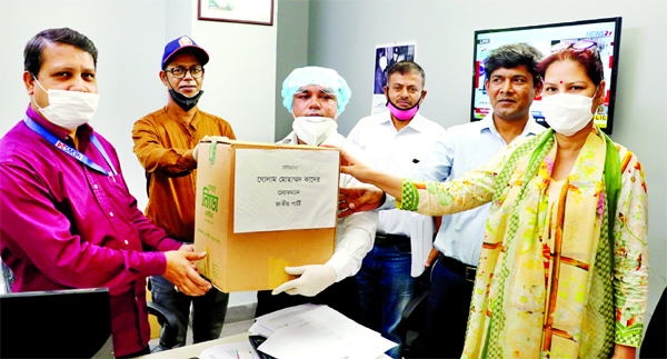 Jatiya Party on behalf of its Chairman GM Kader, MP distributing hand sanitizers and masks at different TV channel and newspaper offices in the city on Wednesday.