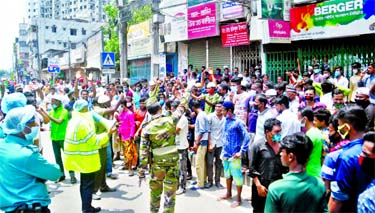 Transport workers staged demonstration in the city's Badda area on Thursday demanding withdrawal of the ongoing ban on public transport service as the measure hits their livelihood.