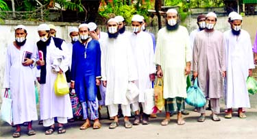 DMP's Counter Terrorism and Transnational Crime (CTTC) unit produce 17 members of banned militant outfit Jamaat-ul-Mujahideen (JMB) before media on Tuesday, following their arrest from the Kakrail area in the capital.