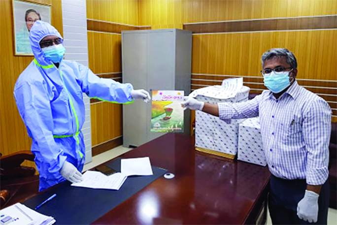 Md Jahangir Alam, Additional Deputy Police Commissioner of Mirpur Zone distributed the medical equipments among the social workers to fight spread of coronavirus. This picture was taken from Kuait Bangladesh Maitree Govt Hospital on Wednesday.