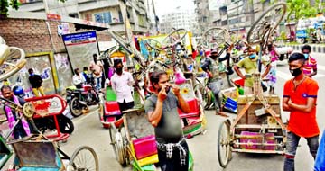 Rickshaws overturned by traffic police at Doyaganj intersection in Dhaka on Thursday while enforcing the nationwide shutdown amid coronavirus spread.