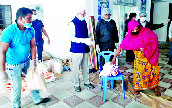 President of Dhaka City South Awami League unit Abu Ahmed Mannafi, distributed food items among the people of low-income groups in city's Wari area on Friday.