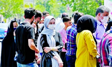 Iranians queue outside a money exchange office in Tehran on Sunday.