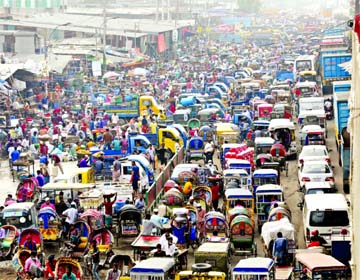 A road in the capital's Jatrabari area gets clogged on Monday amid increased traffic in the wake of a relaxed shutdown across the country.
