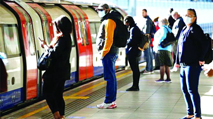 Some passengers at Canning Town underground station in east London wore masks for their commute on Wednesday morning.