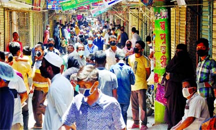 Eid shoppers crowd at Reazuddin Bazar in Chattogram on Saturday ignoring social distancing norms.