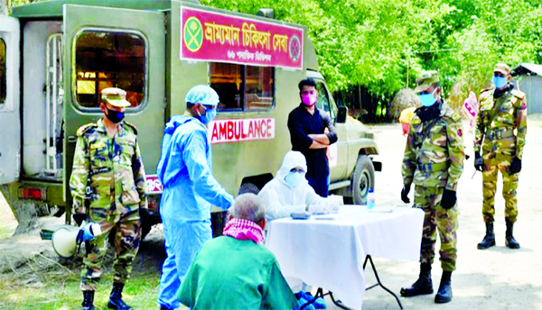 Members of Bangladesh Army providing medical service to distressed people in Kurigram on Monday free of cost to tackle coronavirus pandemic.